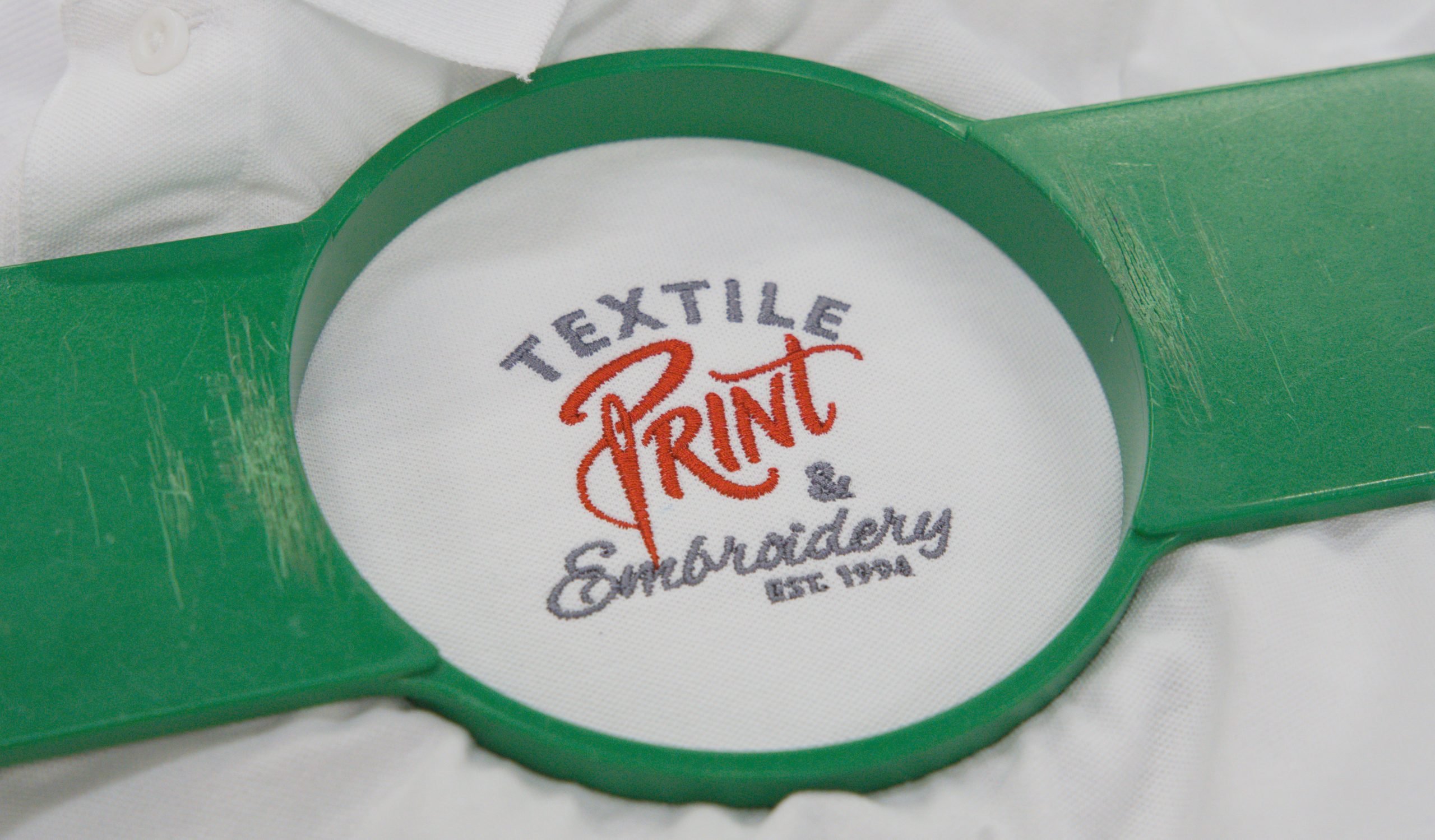 Workwear embroidery running on a machine at Textile Print's Limerick workshop